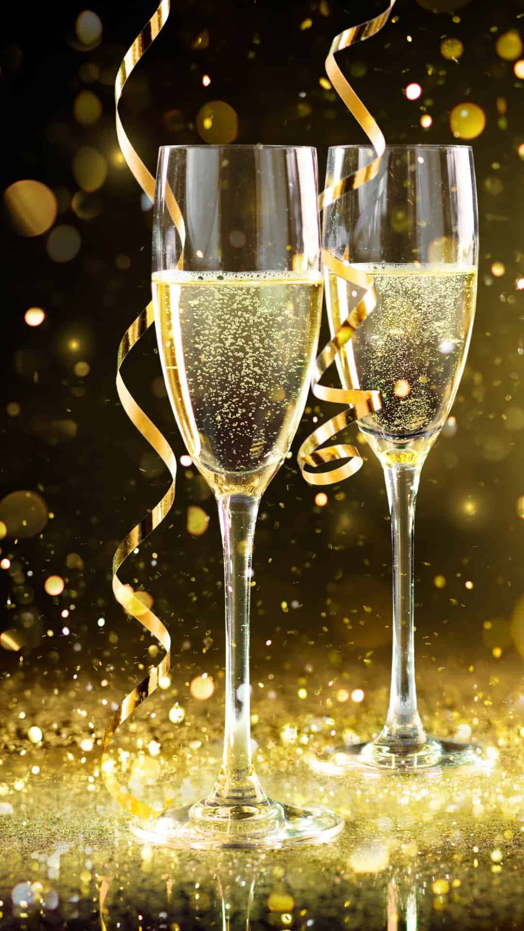 Two Glasses Of Champagne With Gold Confetti Background