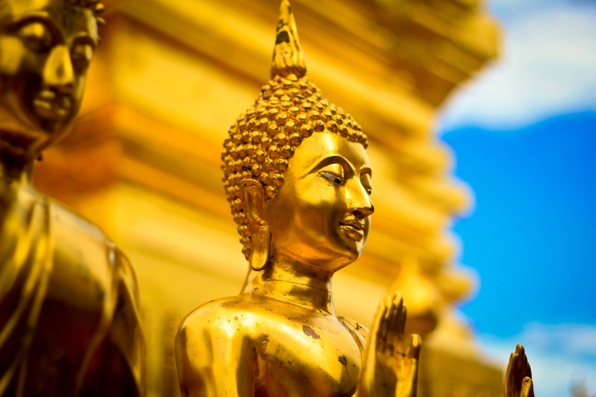 Two Golden Buddha Statues Background