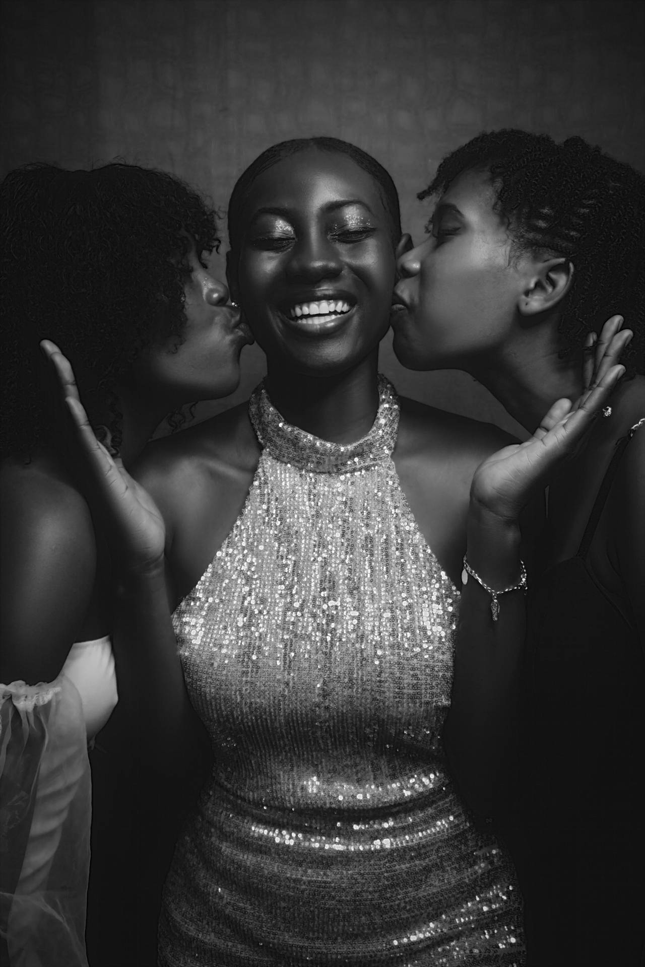 Two Gorgeous Black Women In A Passionate Embrace Background