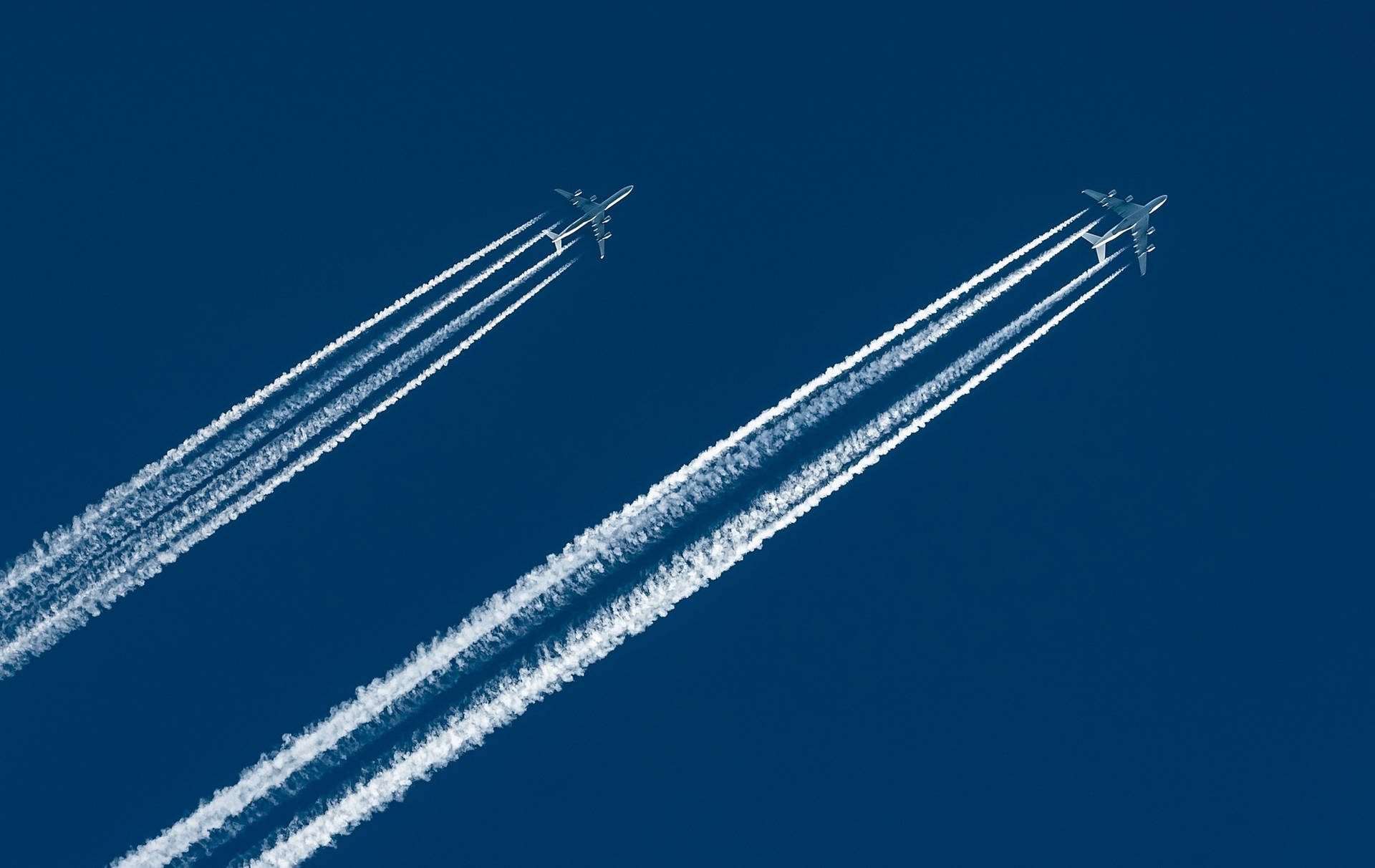 Two Hd Plane With Contrails Background