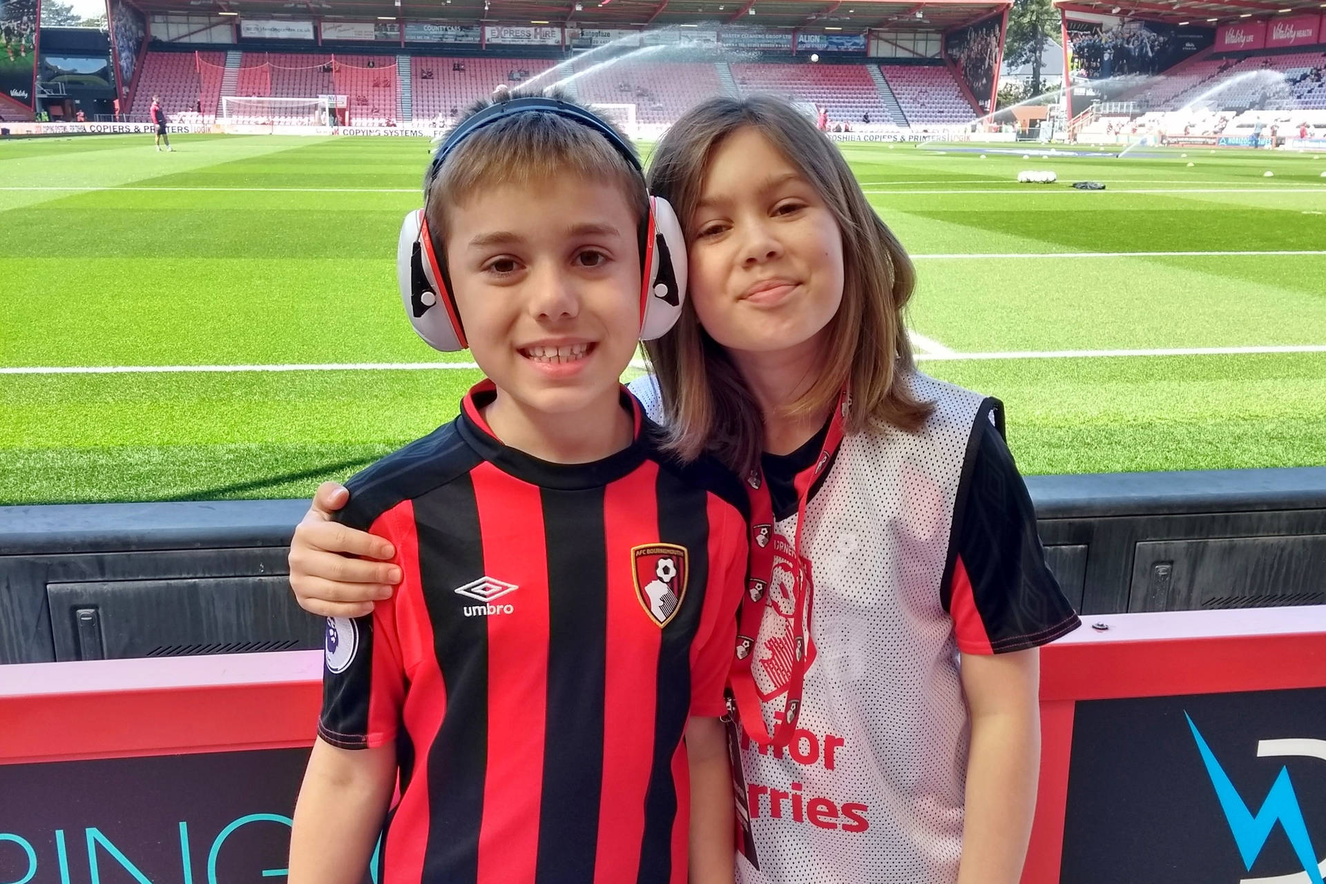 Two Kids Supporting Afc Bournemouth Background