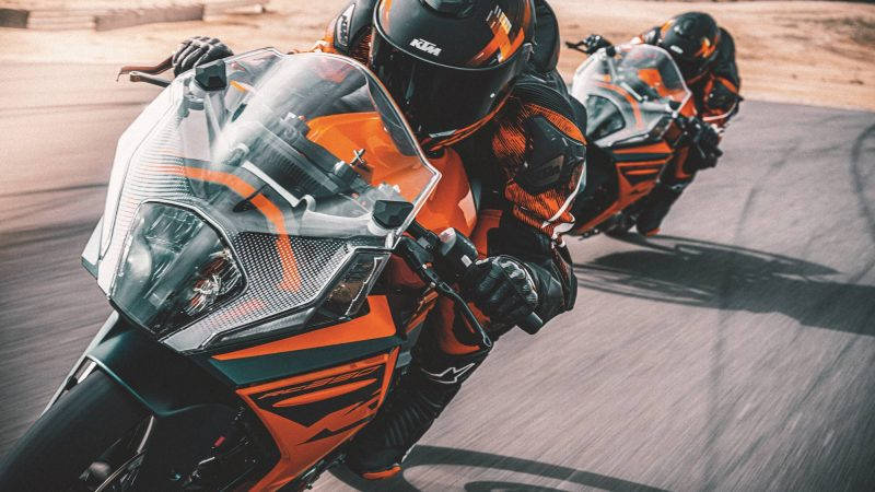 Two Ktm Rc 200s Racing Background