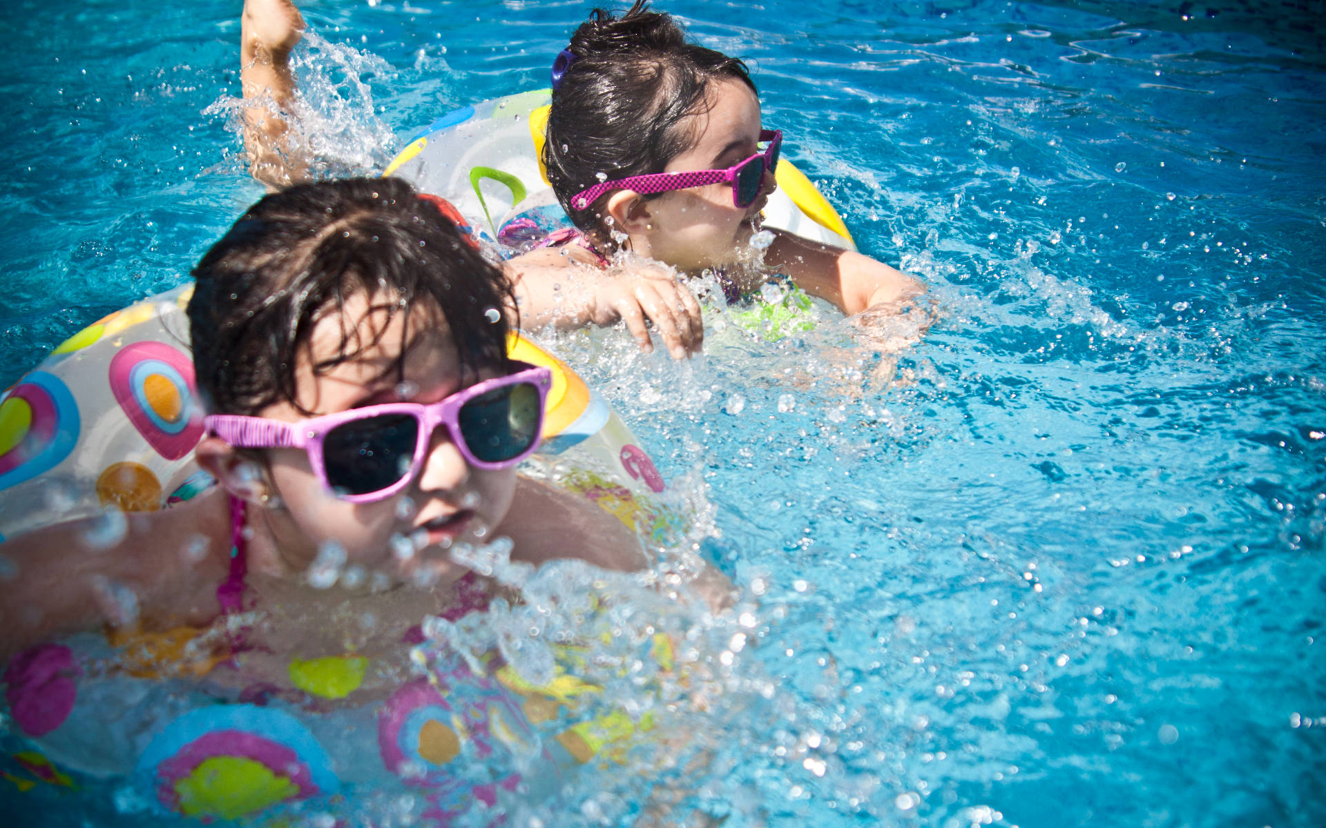 Two Little Girls In Swimming Pool Background