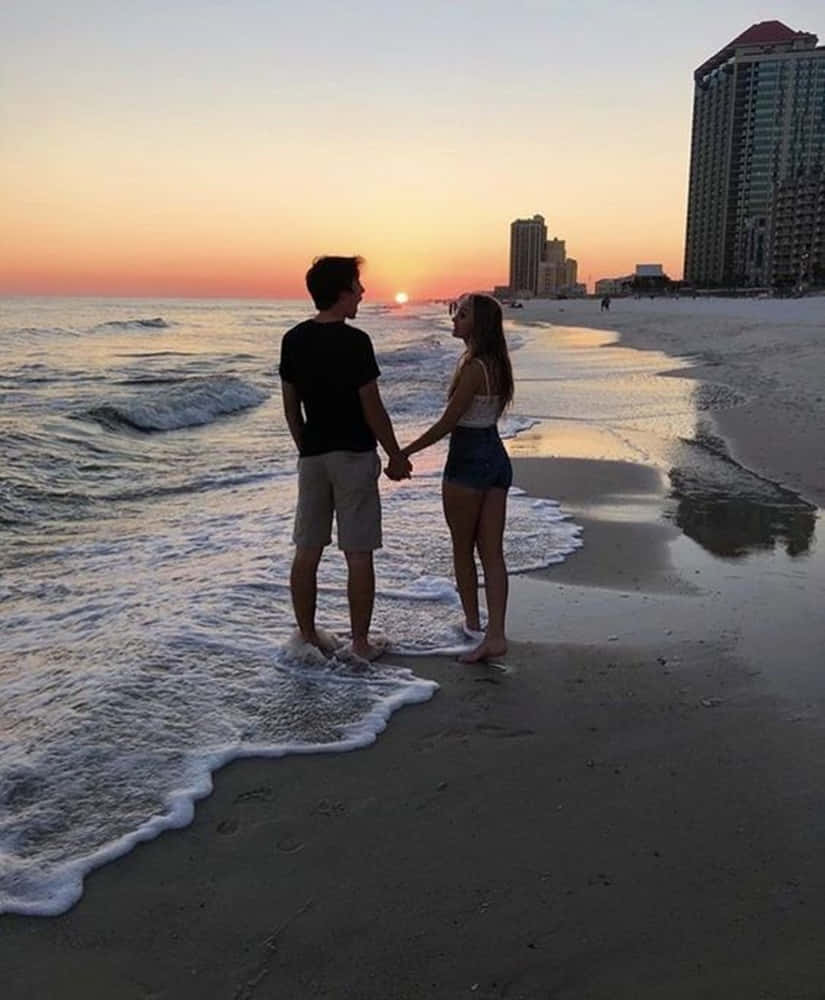 Two Lovers Sharing A Romantic Moment Background