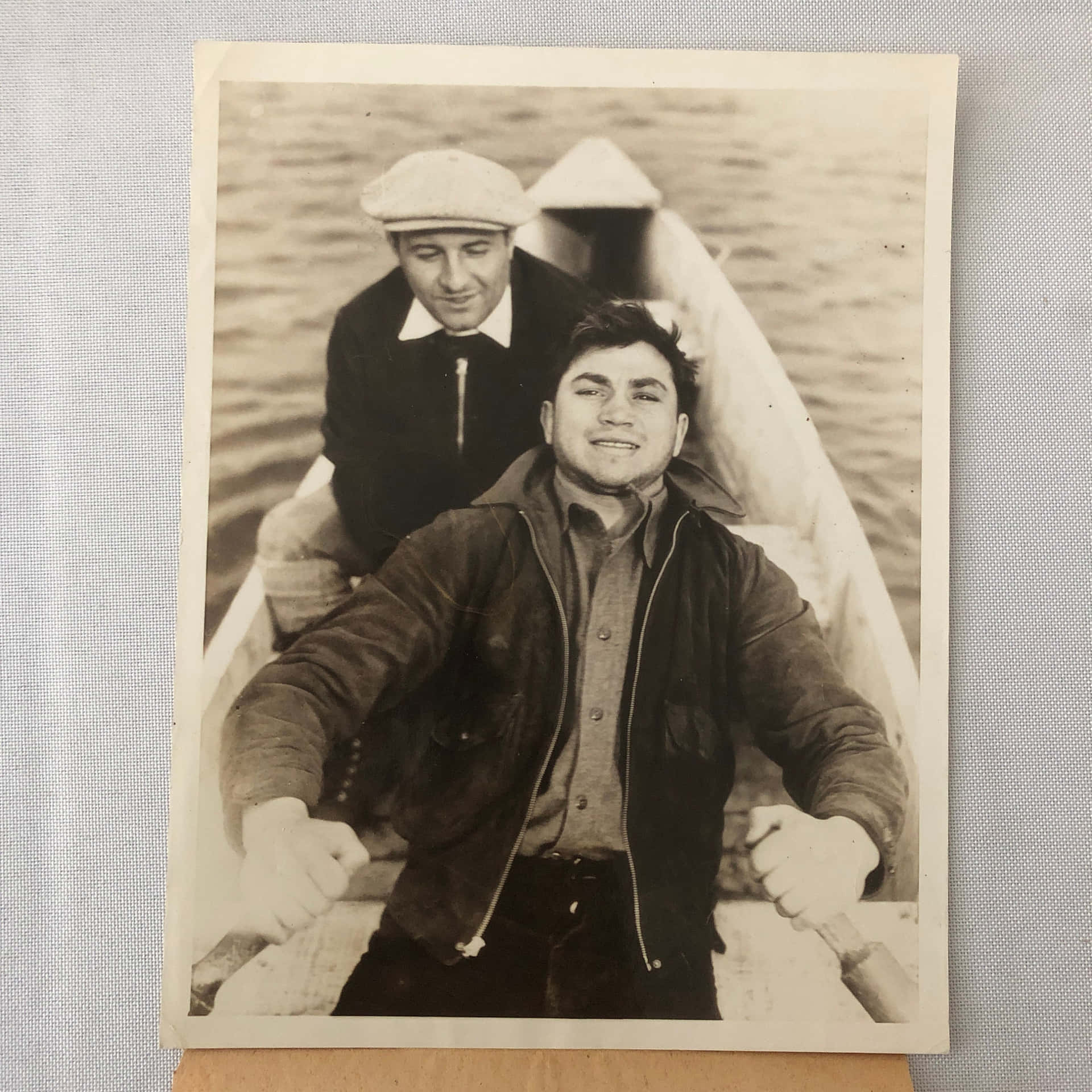 Two Men In A Boat Background
