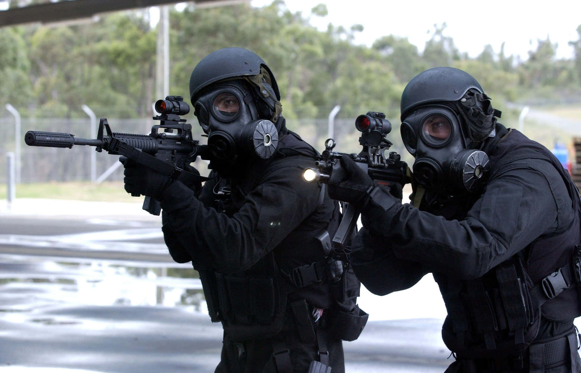 Two Men In Gas Masks Background