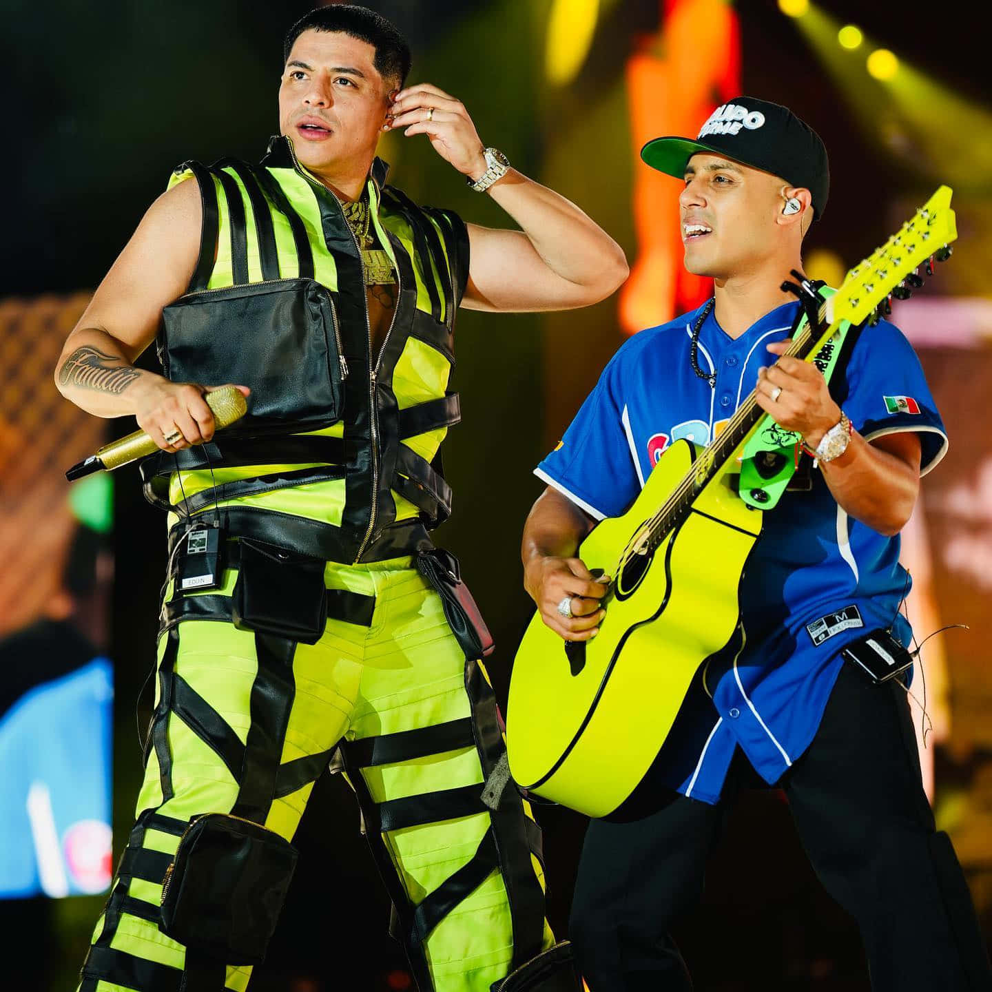 Two Men In Yellow Outfits Background