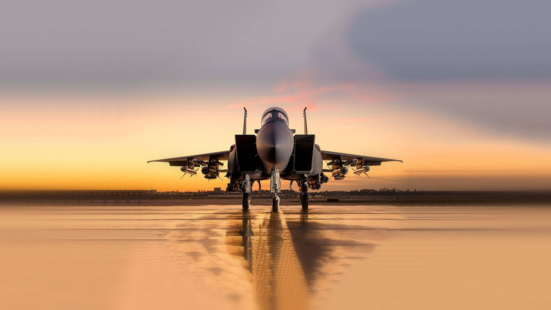 Two Military Jets Soaring Through Clouds Background