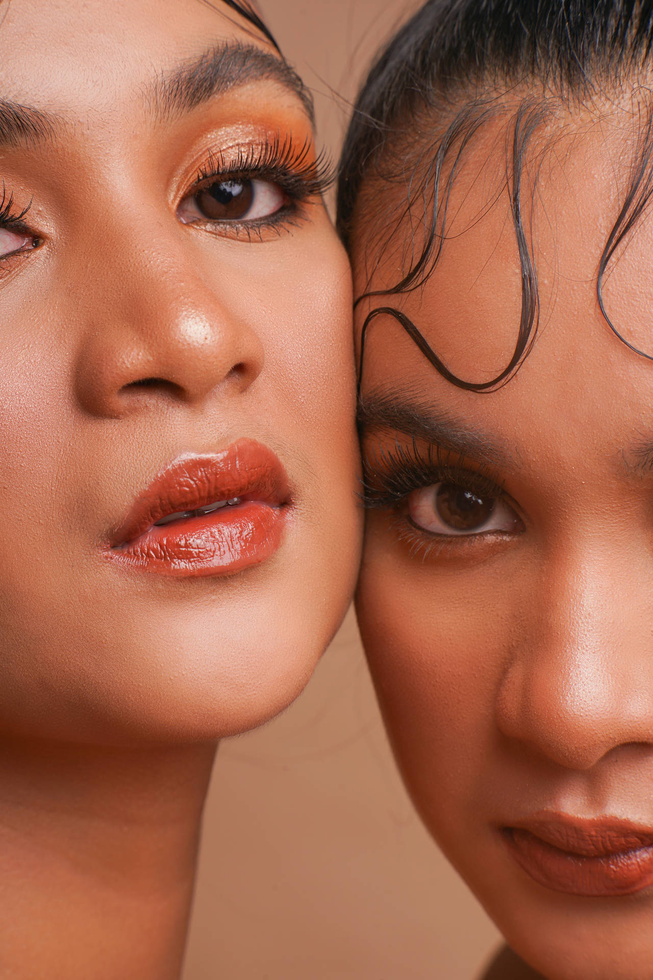 Two Models In Peach Makeup