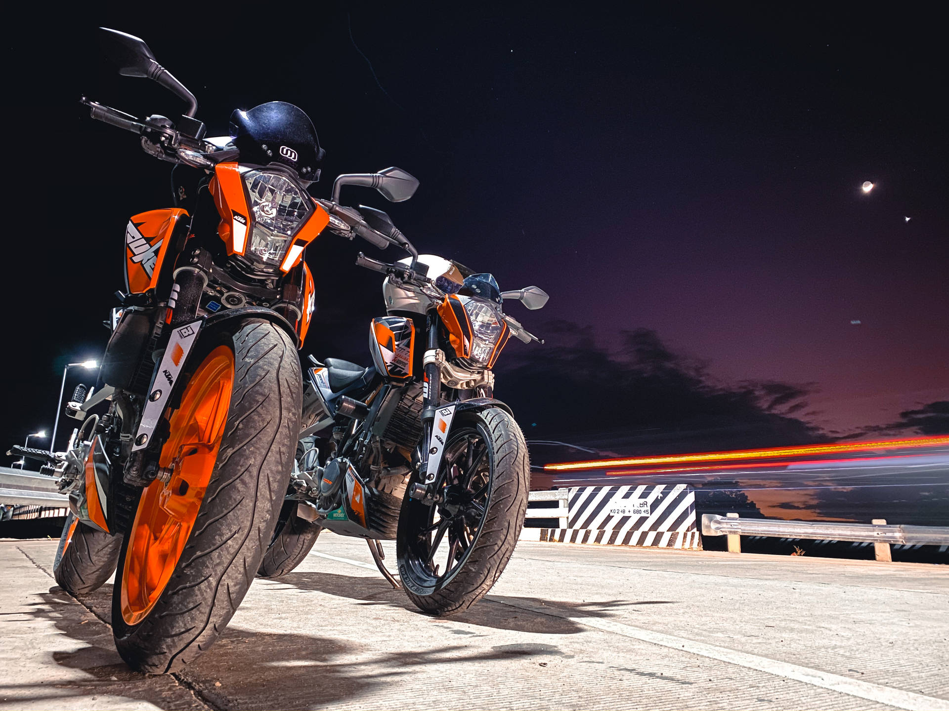 Two Parked Ktm Duke 200 At Night Background