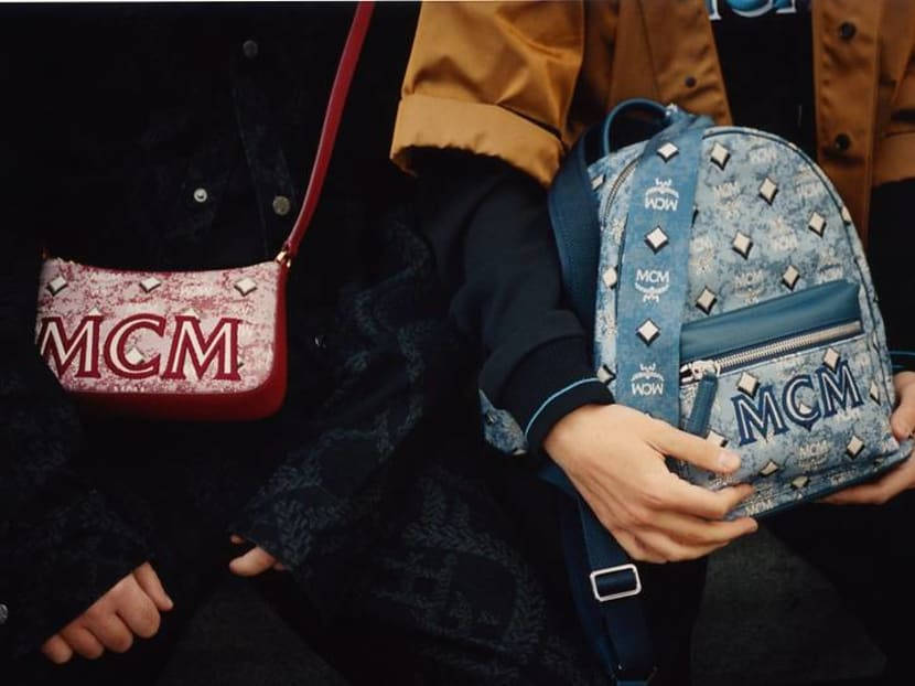 Two People Carrying Mcm Bags