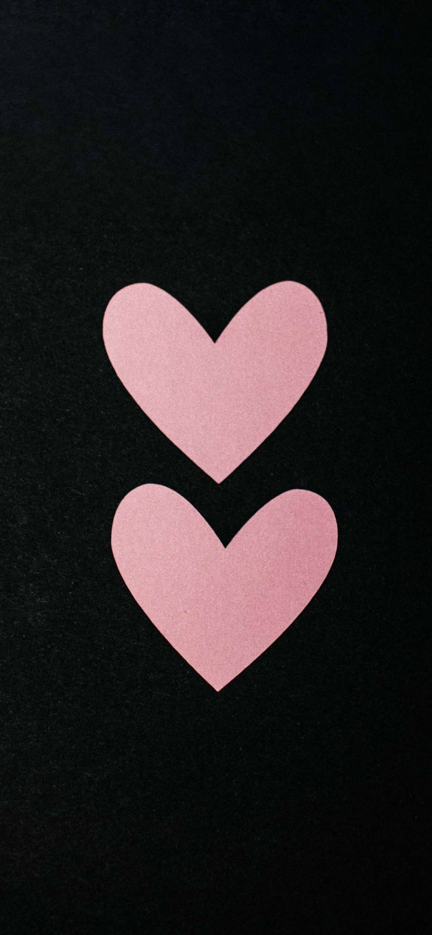 Two Pink Hearts On A Black Background Background