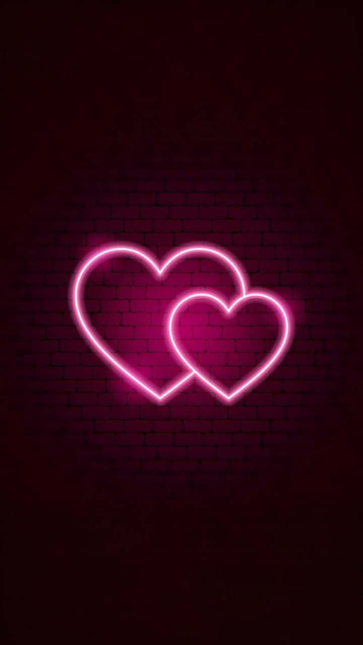 Two Pink Neon Hearts With Brick Wall Background