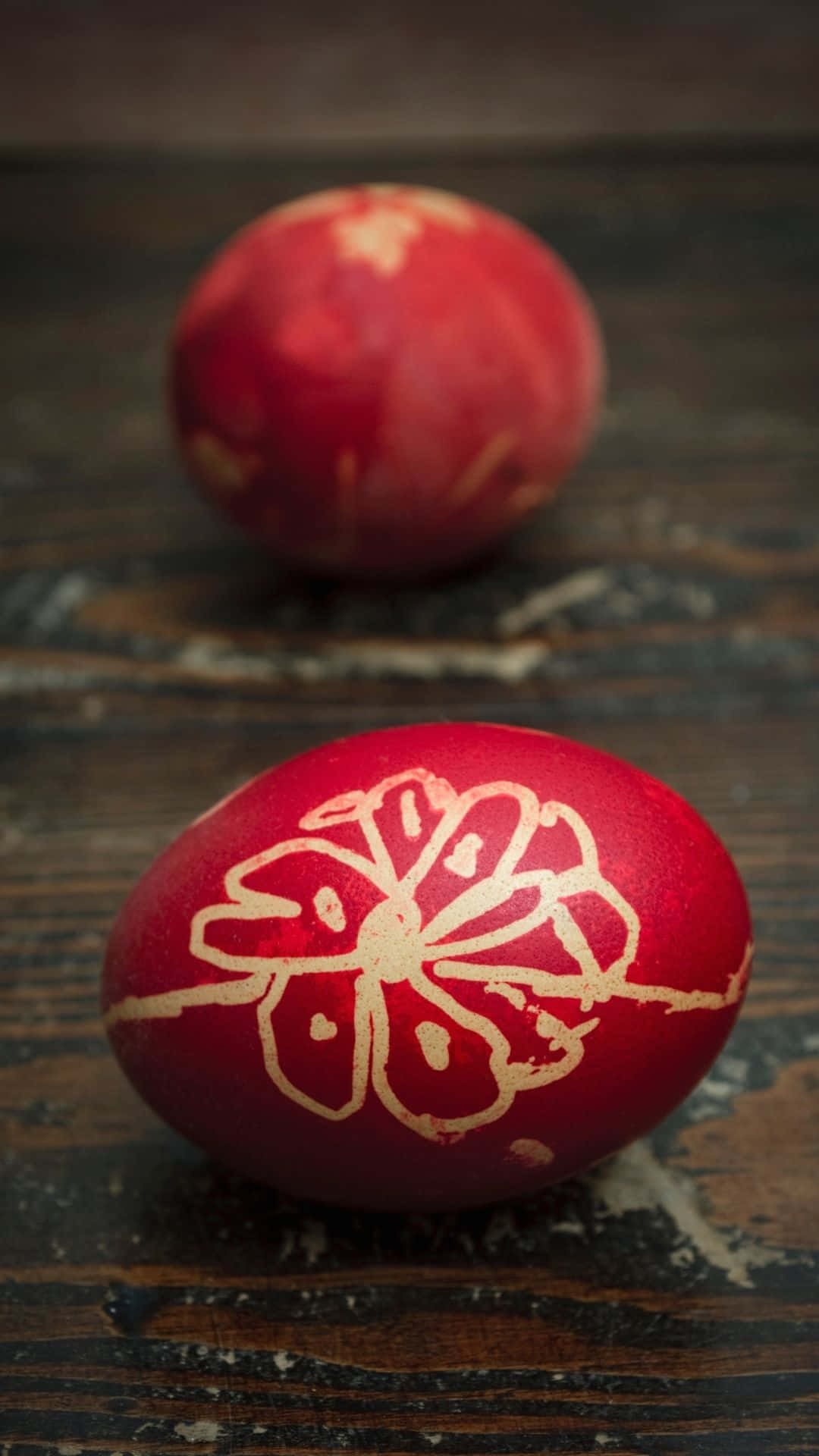Two Red Eggs With A Flower On Them Background
