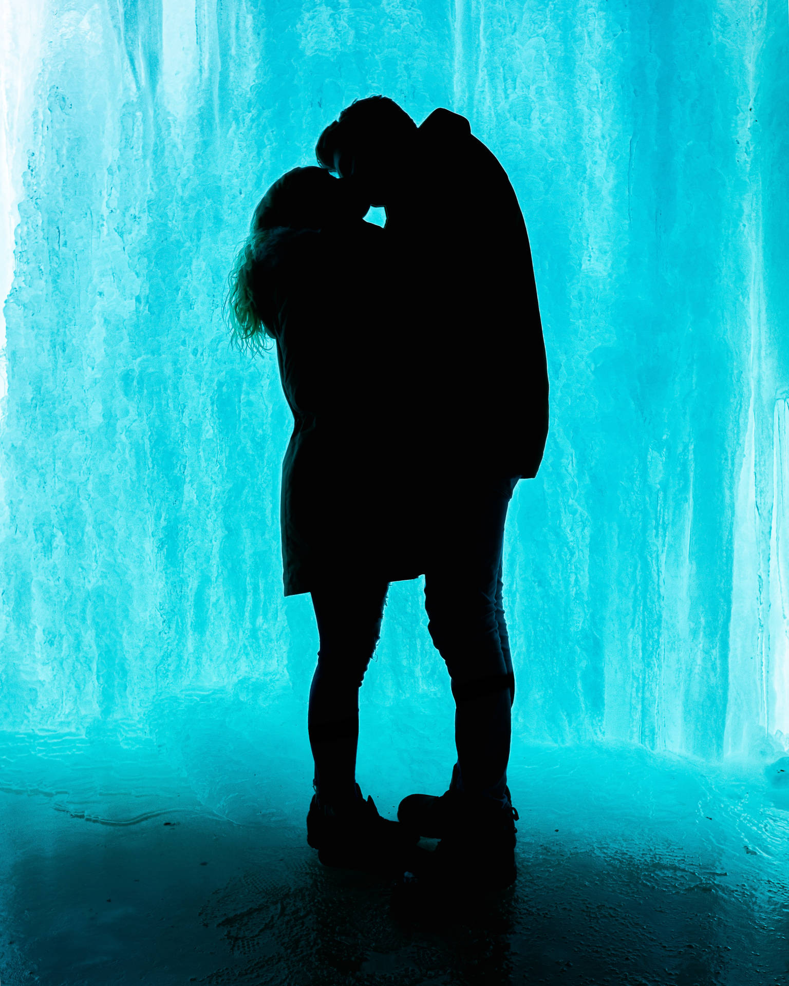 Two Silhouetted Lovers Wrapped In A Passionate Embrace. Background
