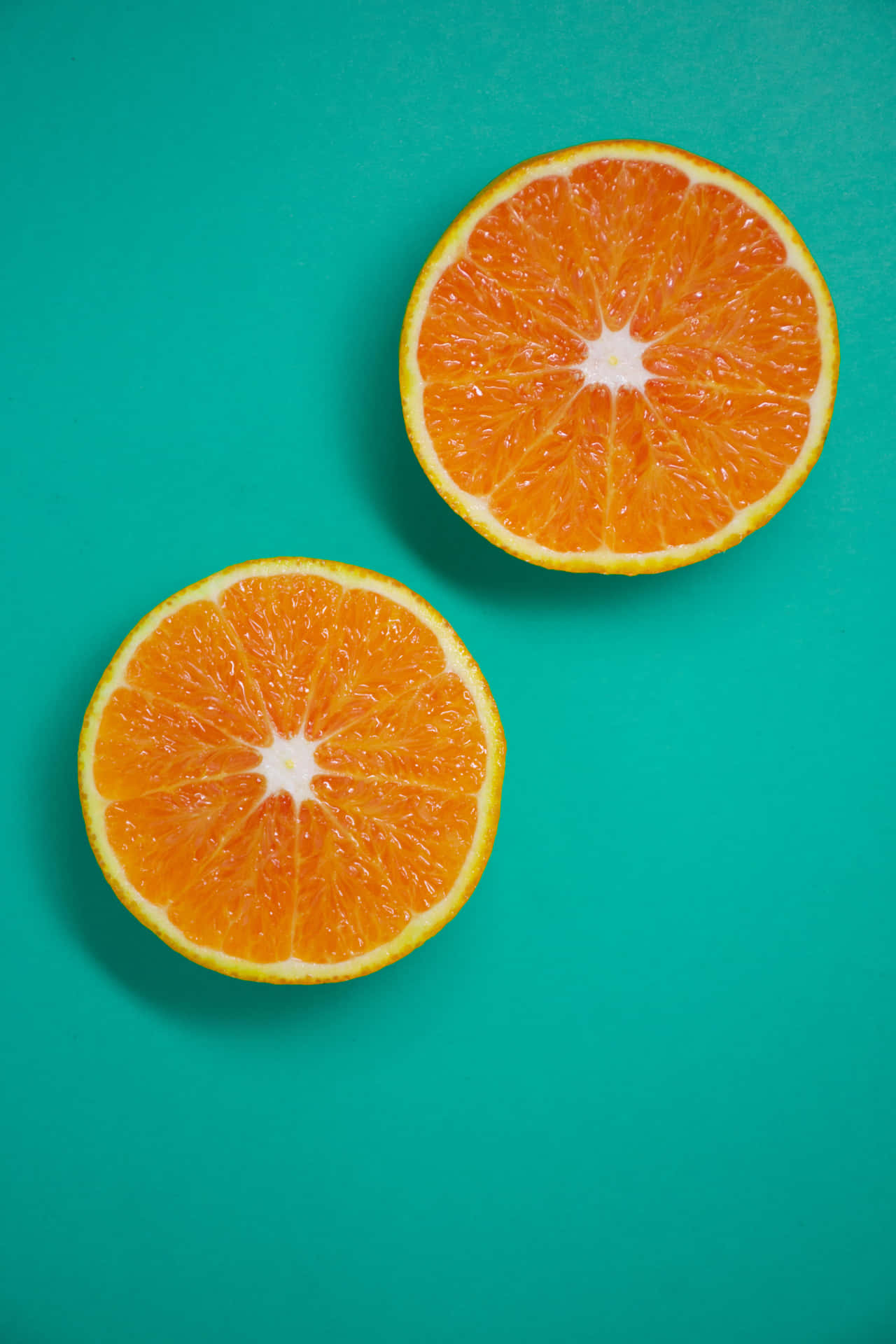 Two Slices Of Orange And Teal Background