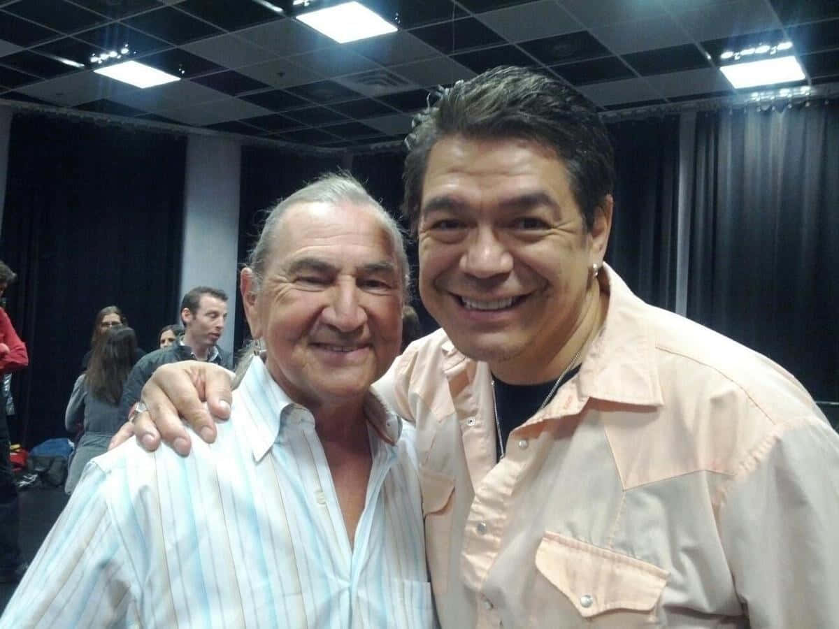 Two Smiling Men Backstage Background