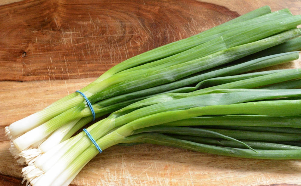 Two Sorted Spring Onion Scallions Background