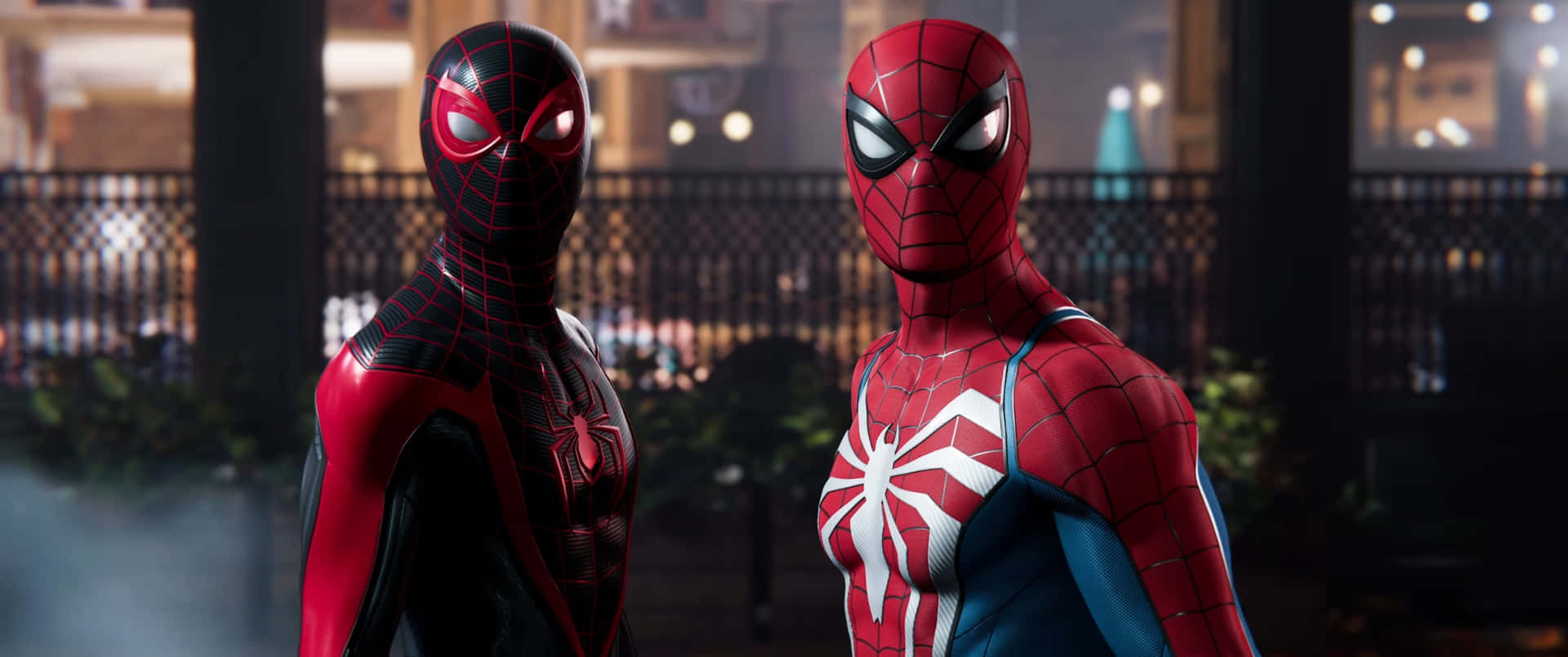 Two Spider - Man Characters Standing Next To Each Other Background