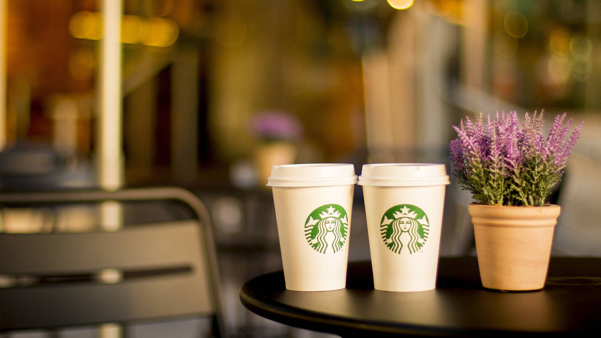 Two Starbucks Styro Cups On Table Background
