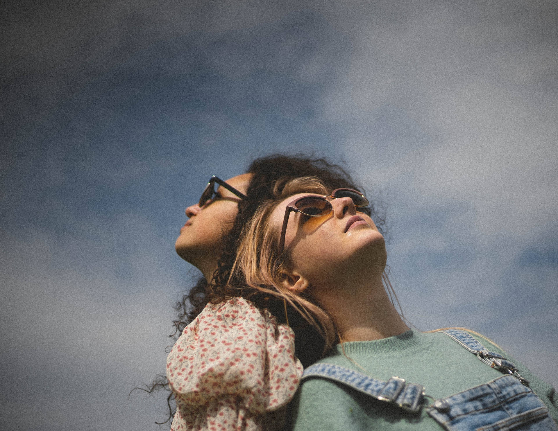 Two Teenage Girls Wearing Sunglasses Background