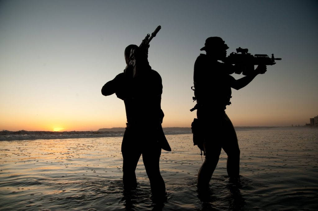 Two U S Navy Seals Standing On Water