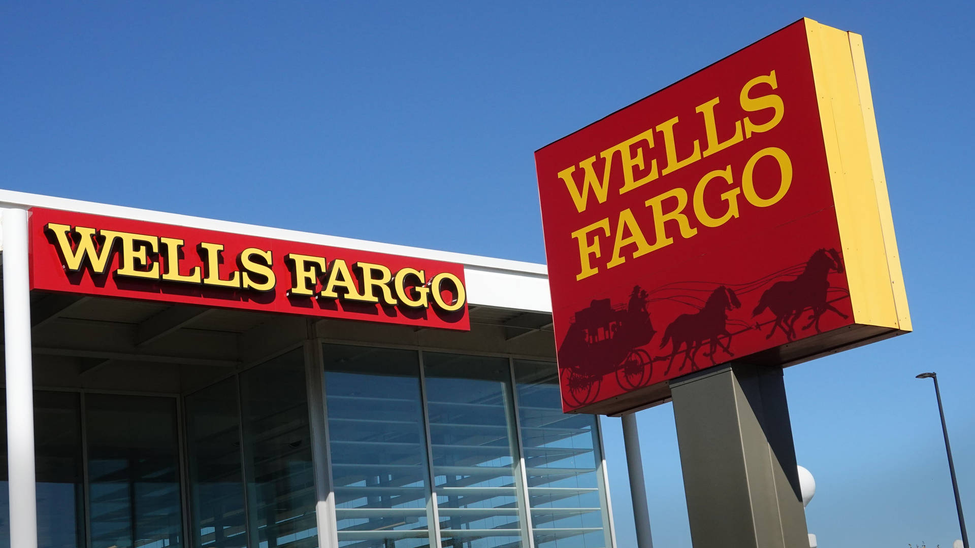 Two Wells Fargo Store Signs Background