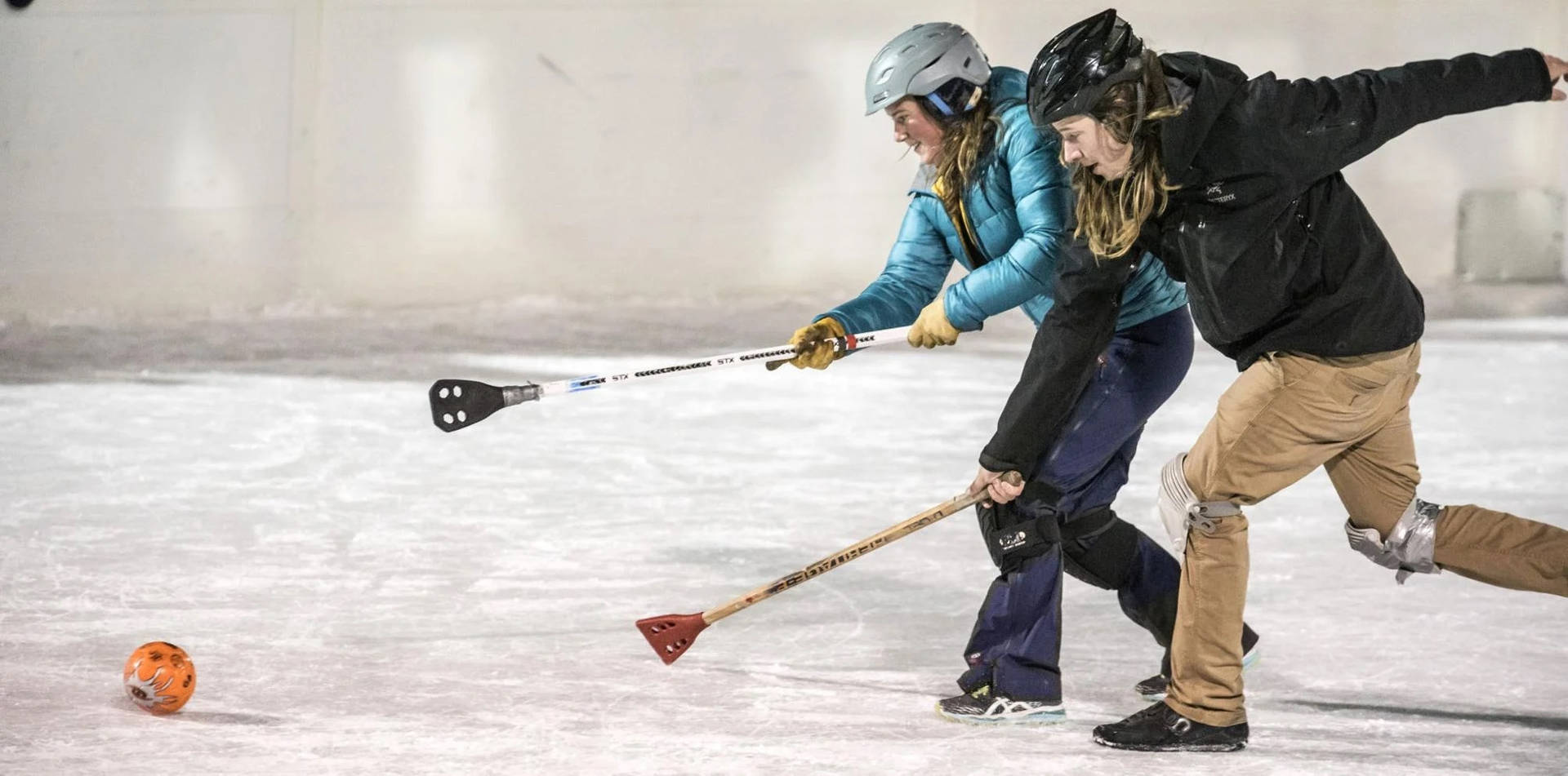 Two Women Broomball Players Background