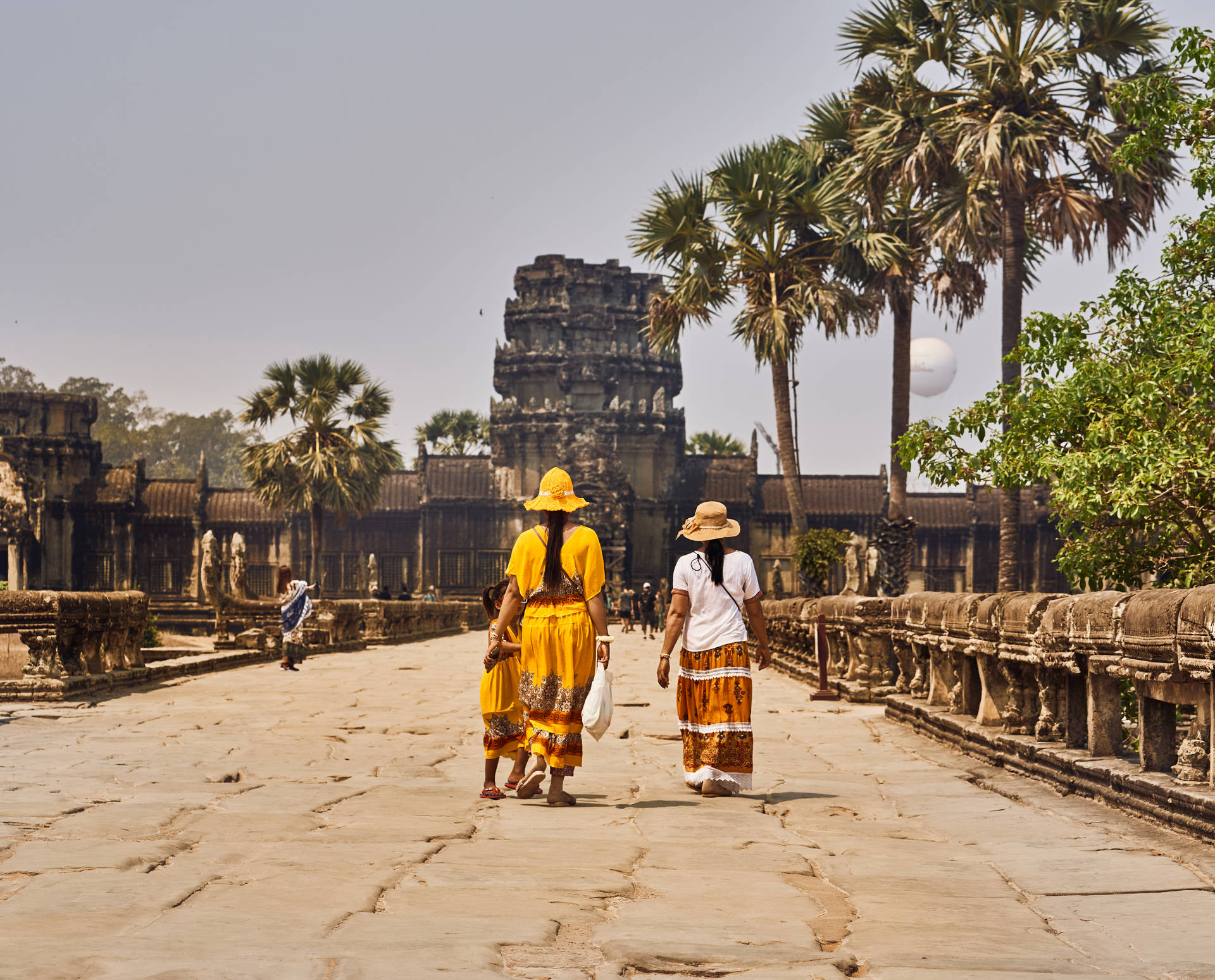 Two Women In Cambodia Temple Background