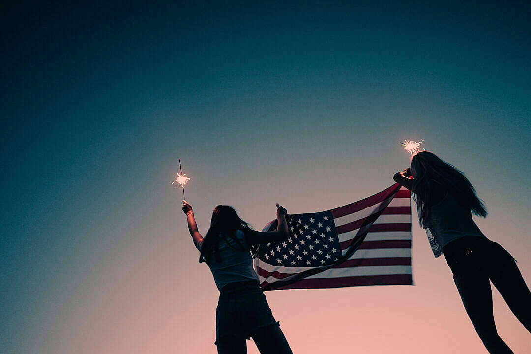 Two Women With Flag Freedom Background