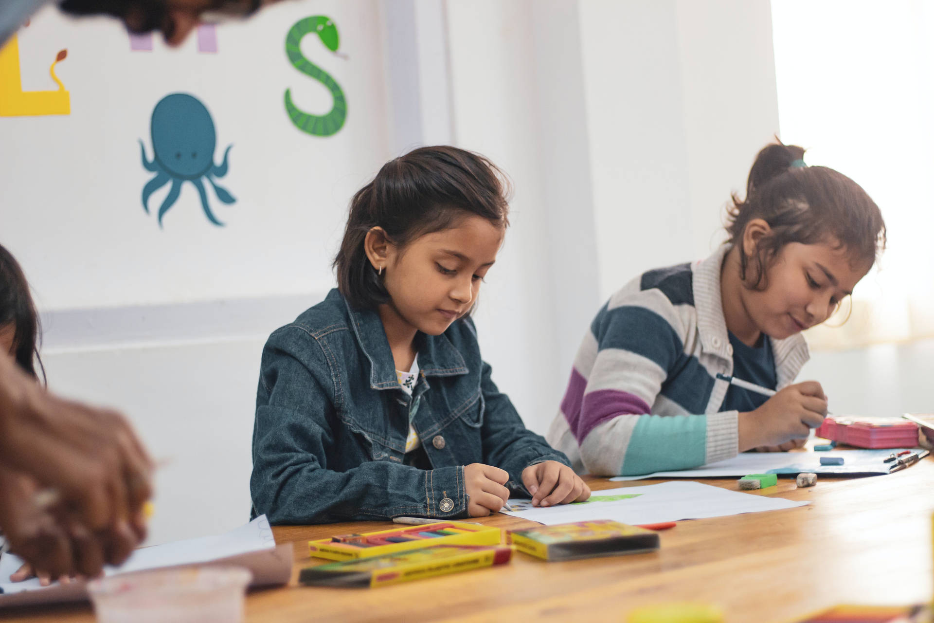 Two Young Girls Learning