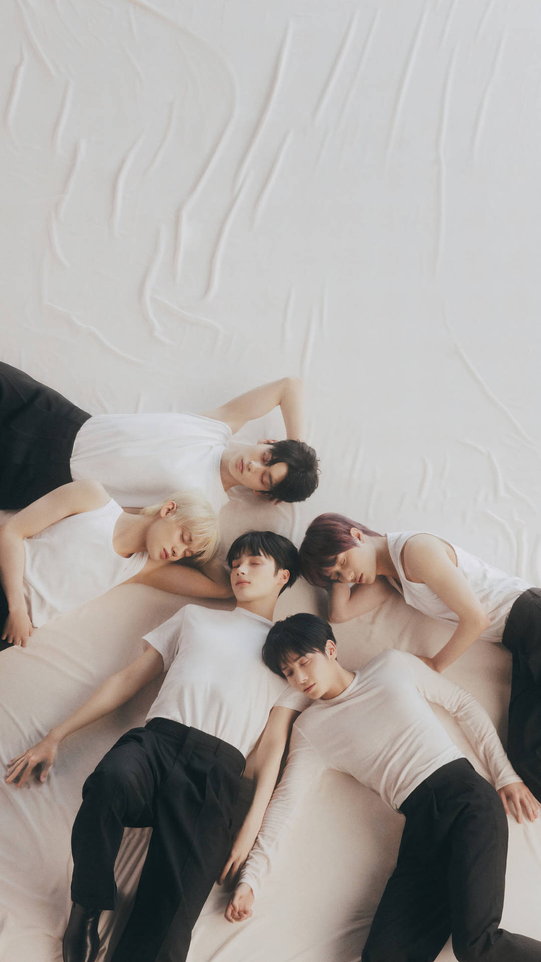 Txt Sleeping On A Bed Background