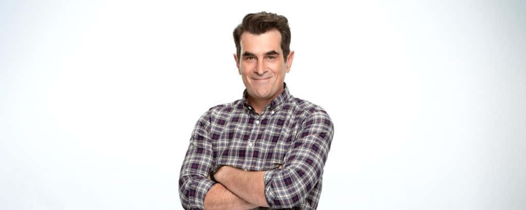 Ty Burrell Smiling At An Event Background