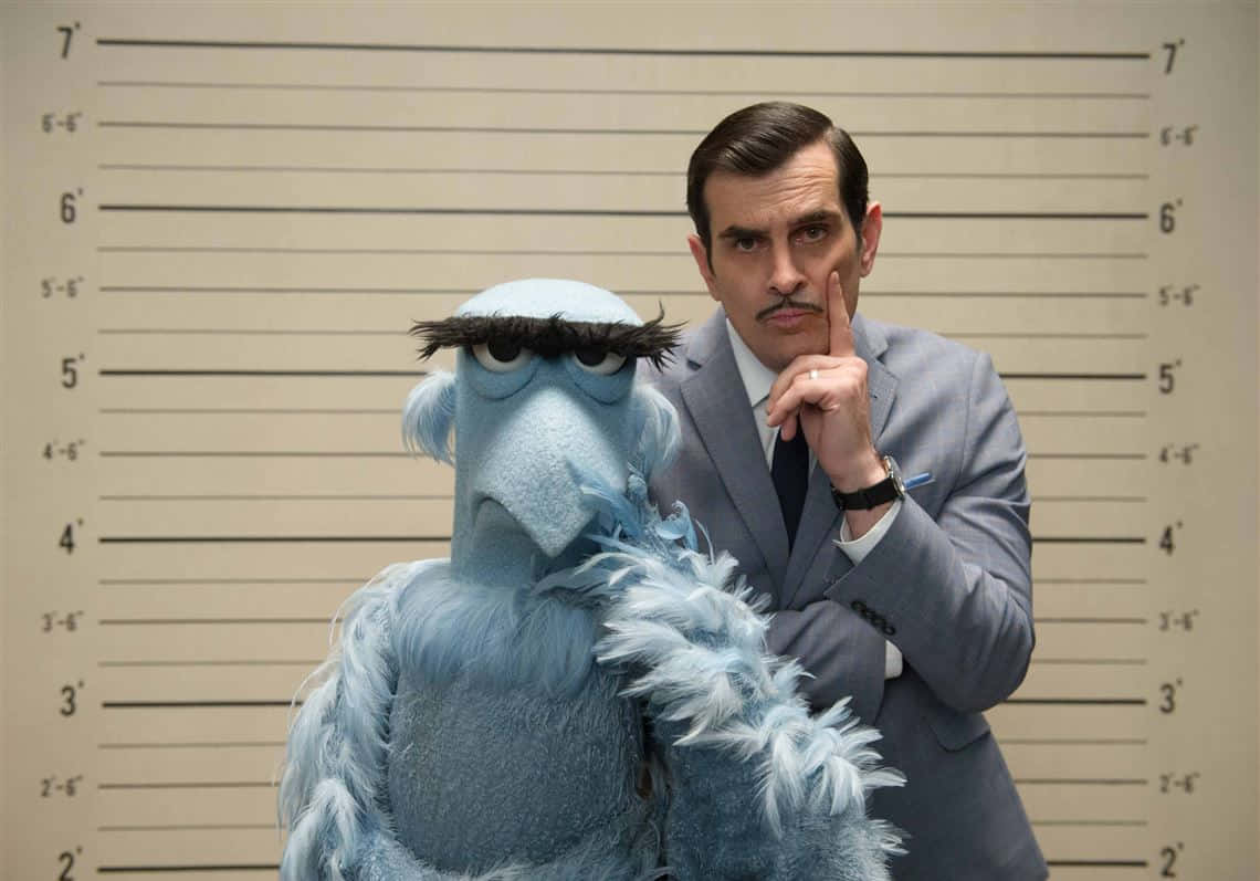 Ty Burrell Smiling At An Event Background