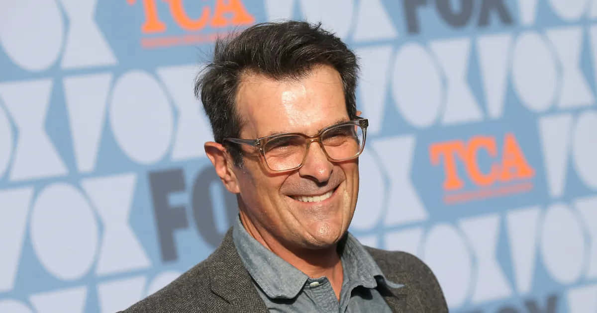 Ty Burrell Smiling During An Interview Background