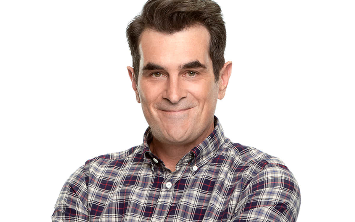 Ty Burrell Smiling In A Classy Suit Background