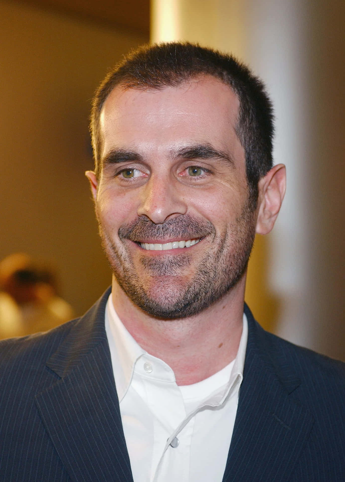Ty Burrell Smiling In Black Suit Background