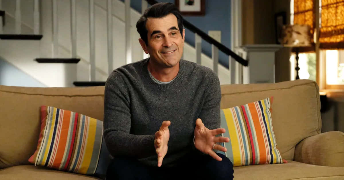 Ty Burrell Smiling On A Red Carpet Event Background