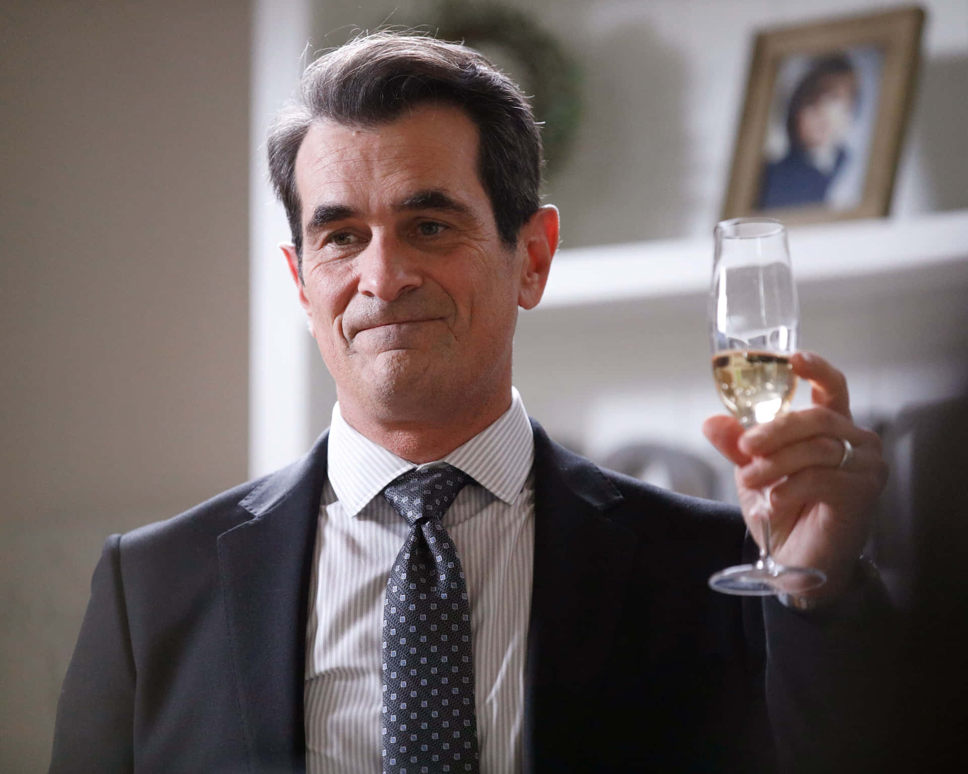 Ty Burrell Smiling Radiantly In A Casual Photoshoot Background