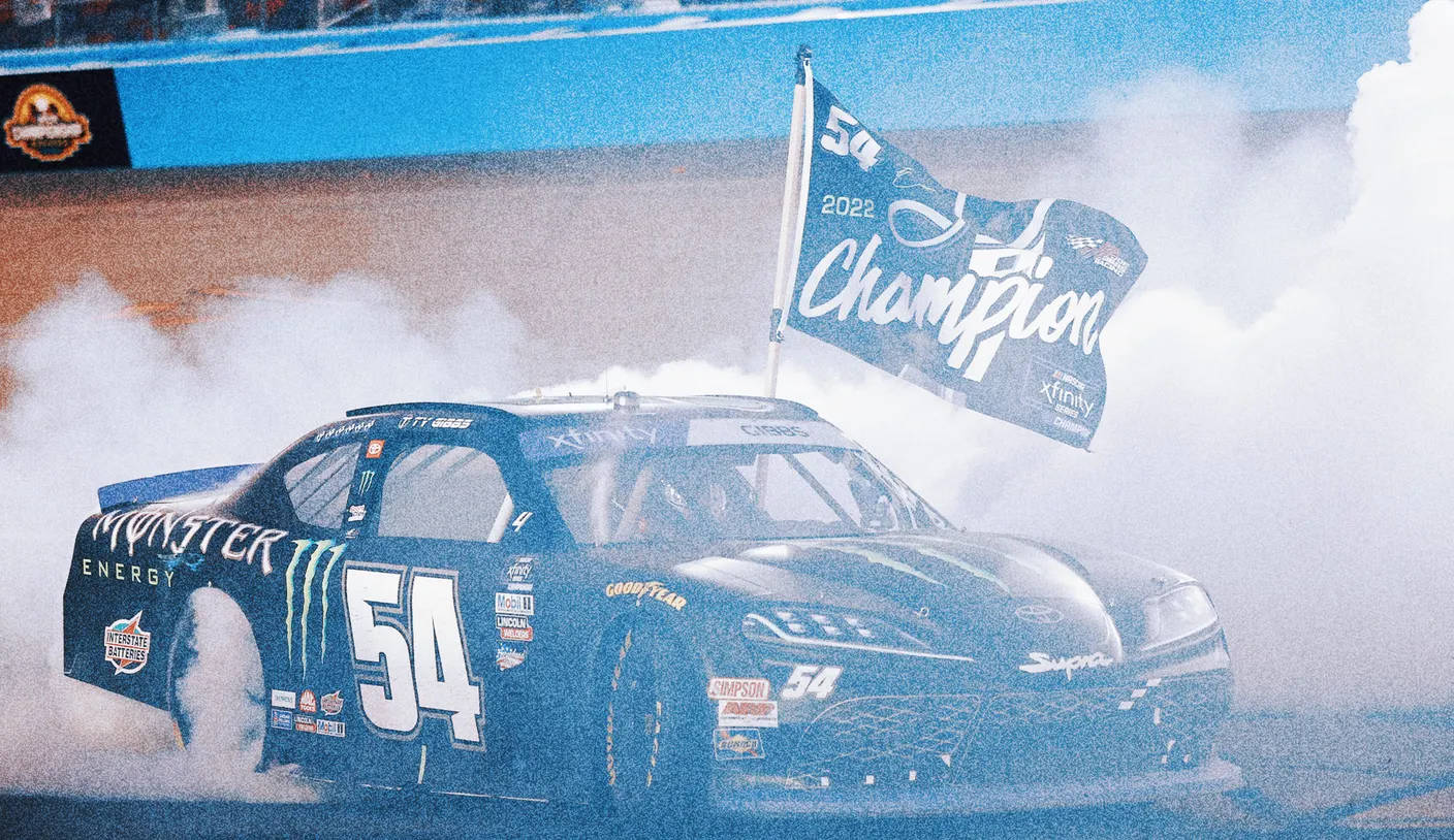 Ty Gibbs Surrounded By Tire Smoke Background