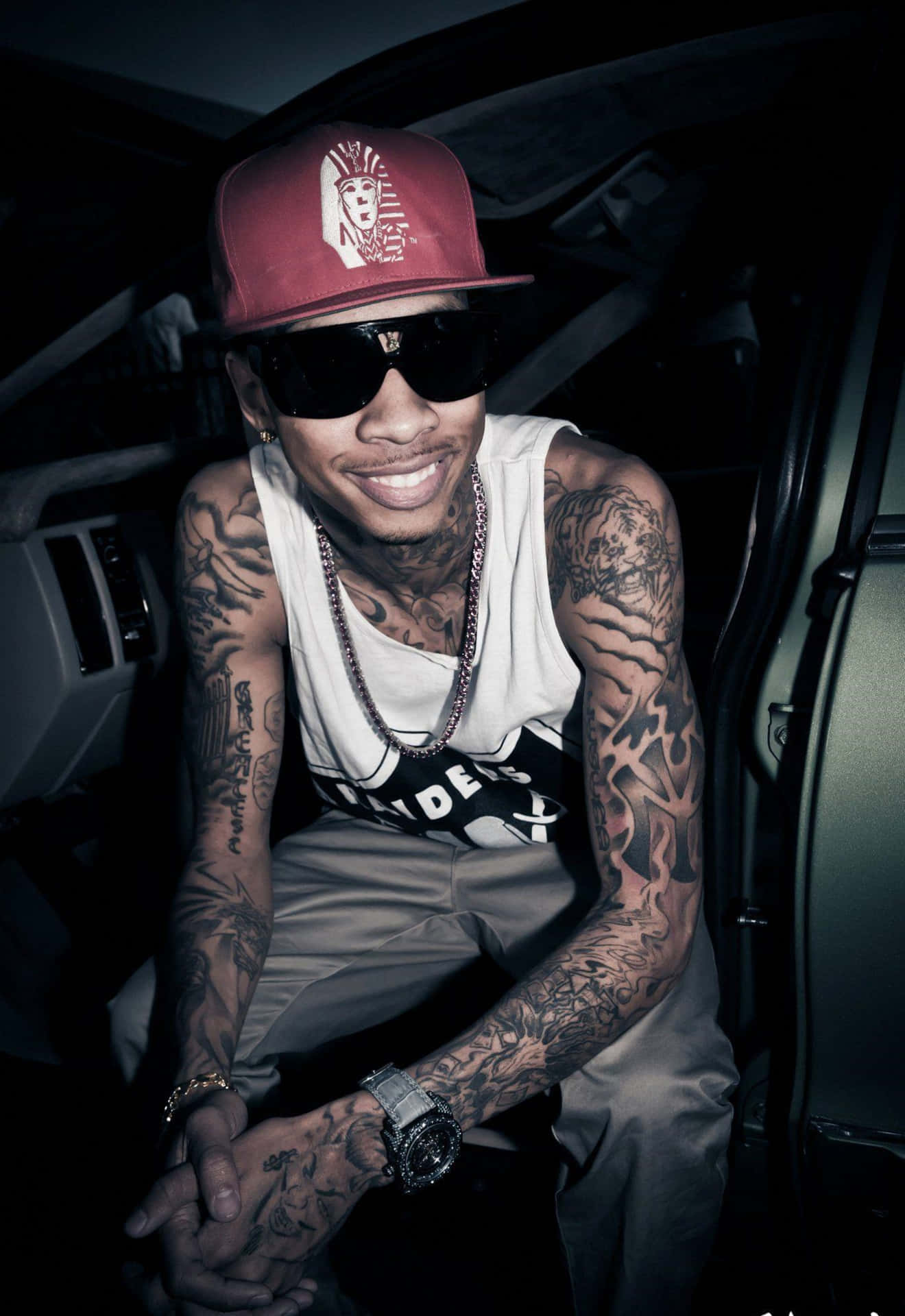 Tyga Looks Cool And Confident Background