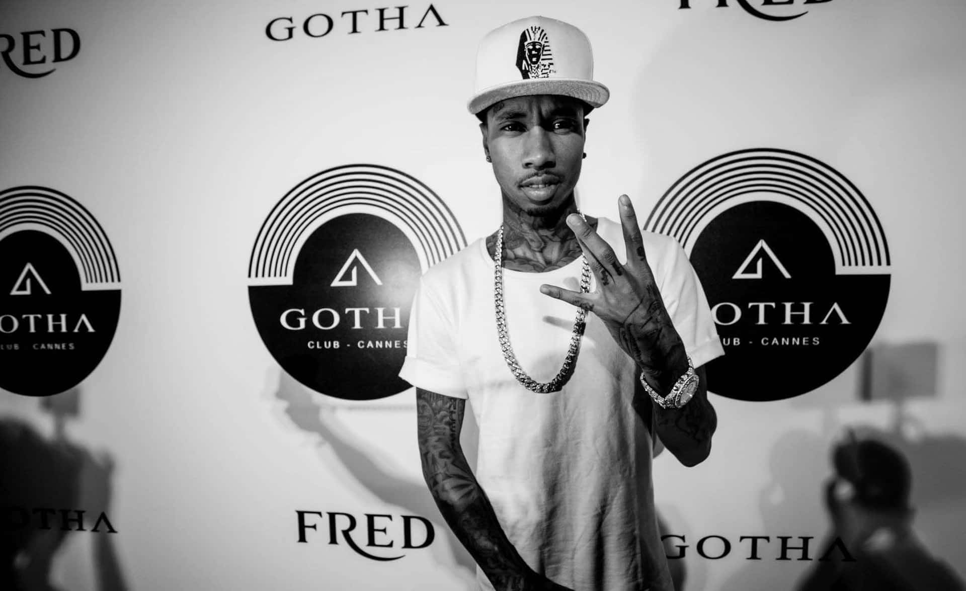 Tyga Poses In A Red Leather Jacket Background