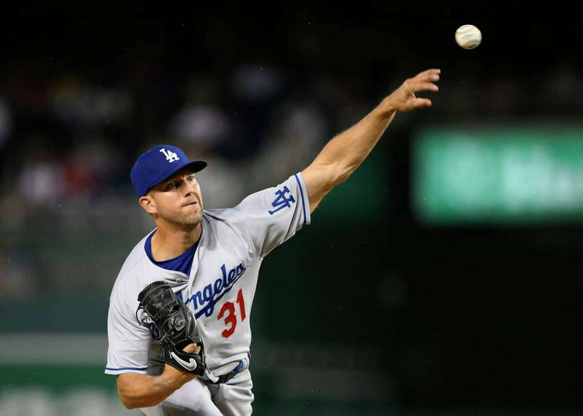 Tyler Anderson Throwing Baseball In Air Background