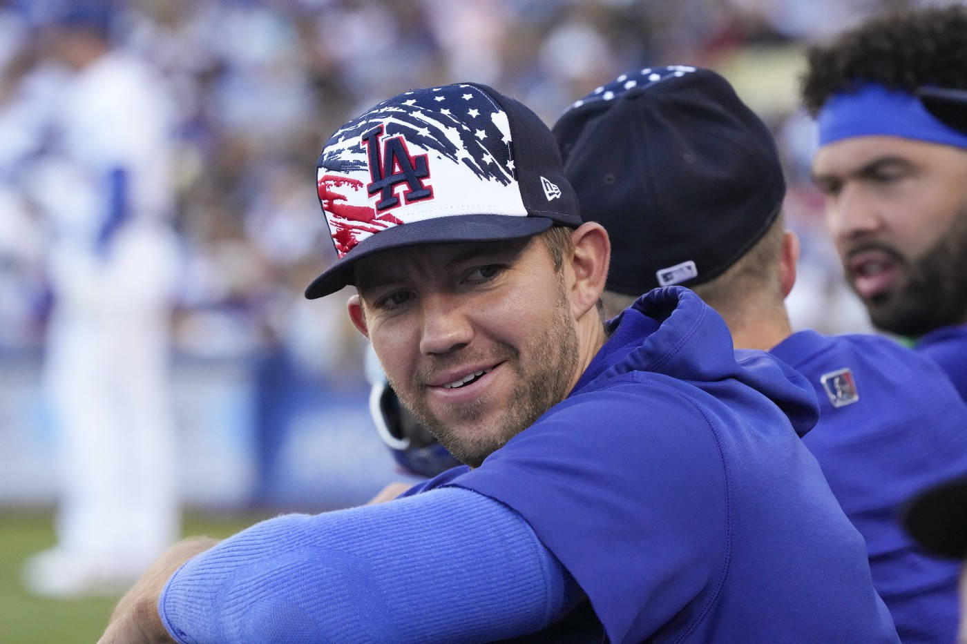 Tyler Anderson Wearing Blue With Teammates Background