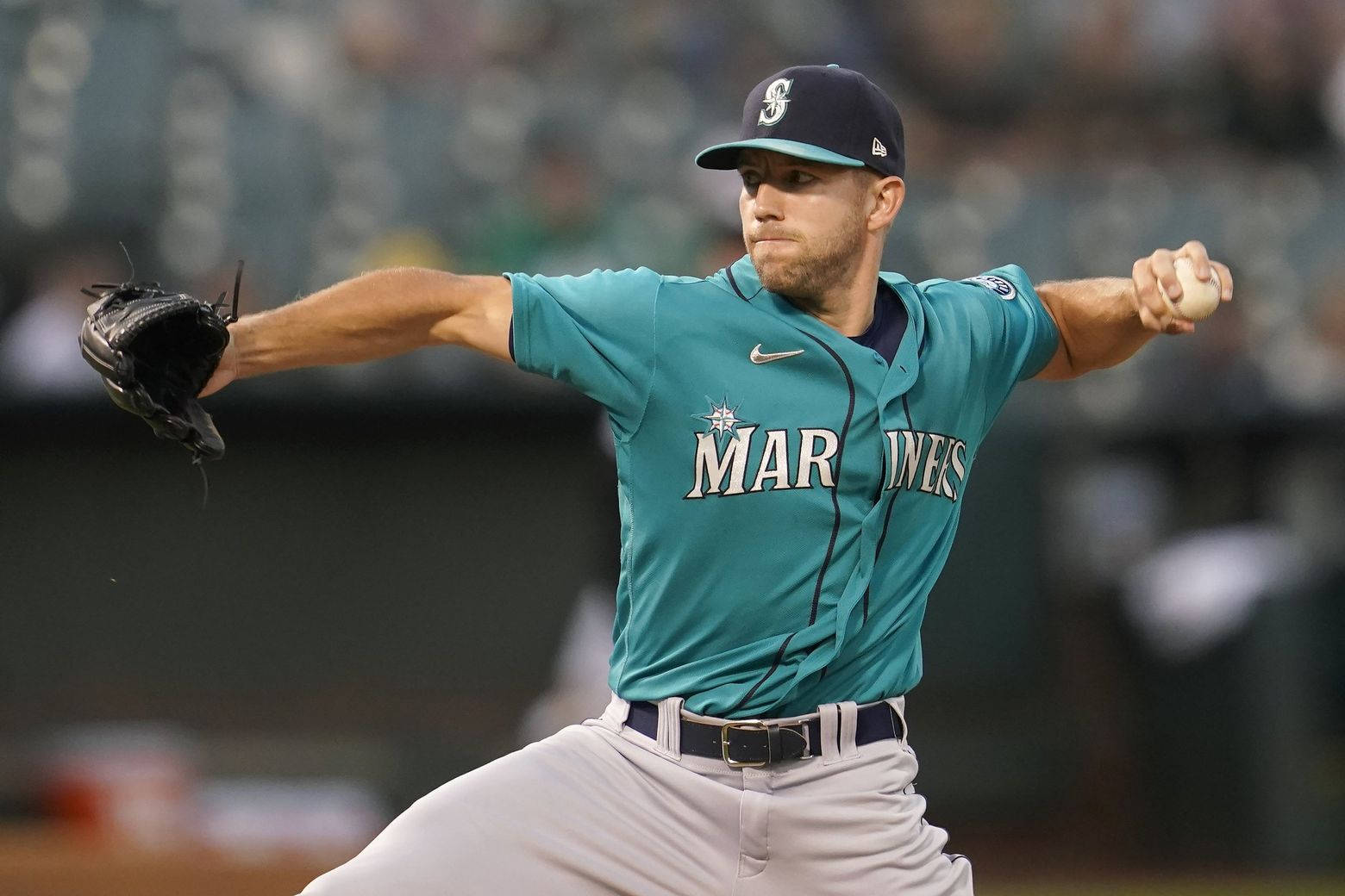 Tyler Anderson Wearing Teal Mariners Jersey Background