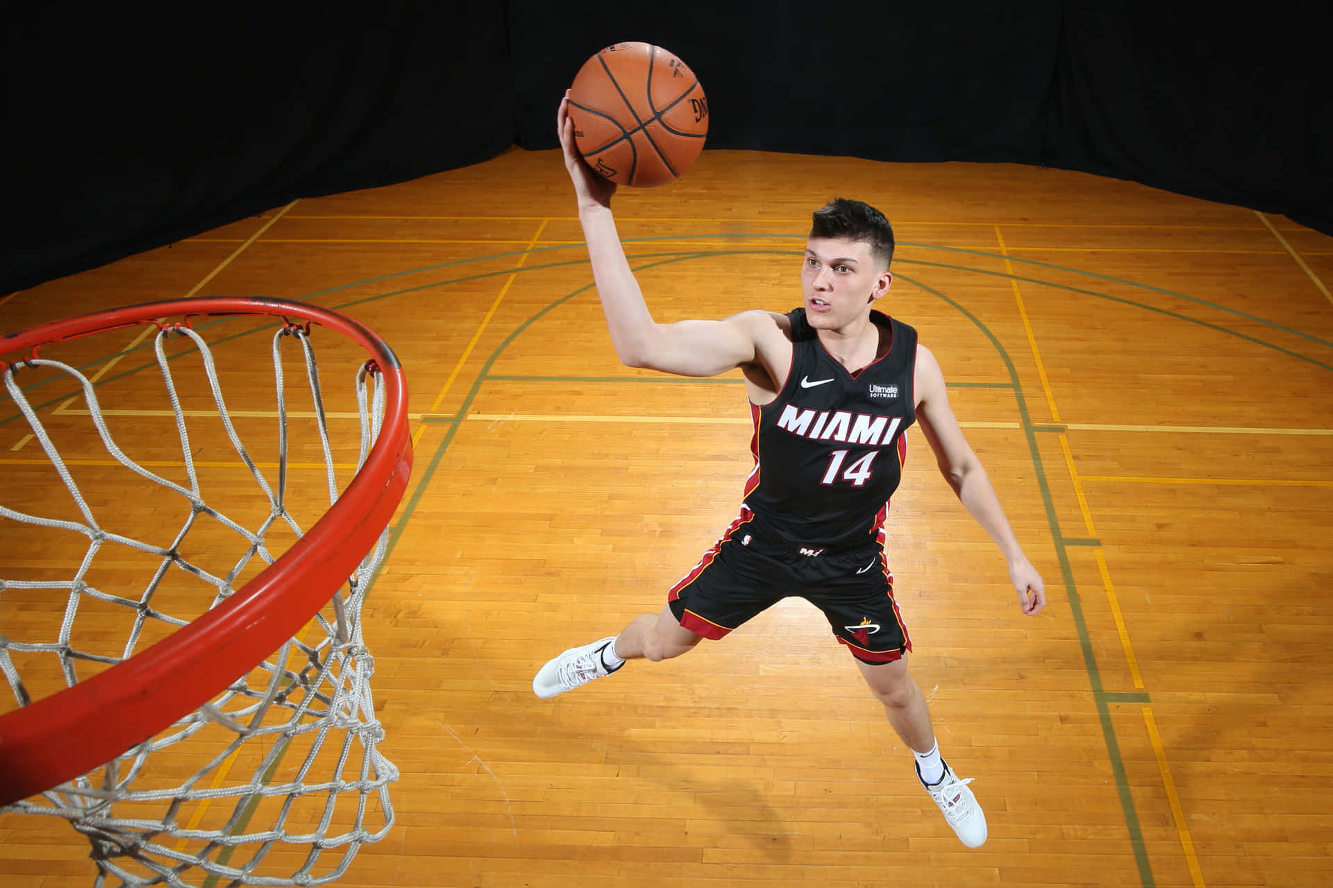 Tyler Herro Of The Miami Heat Slam Dunking The Ball Background