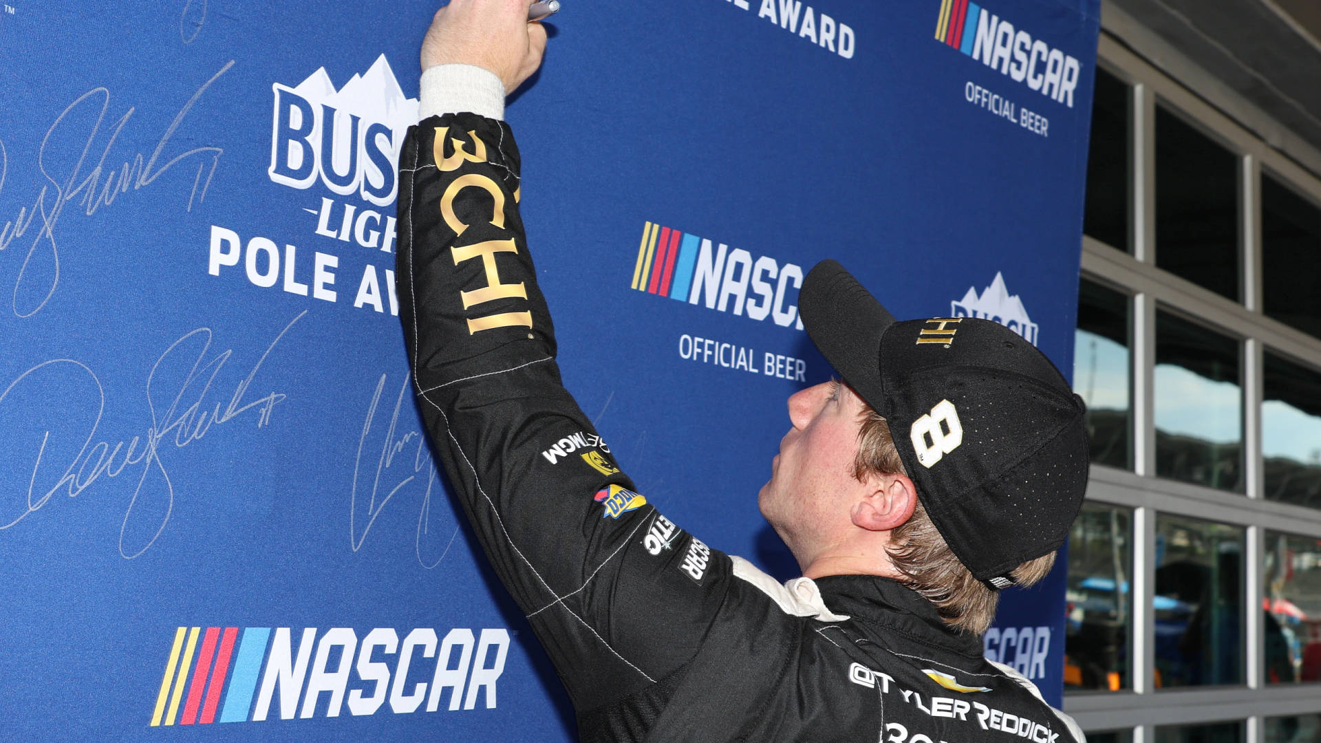 Tyler Reddick Signing The Backdrop Background