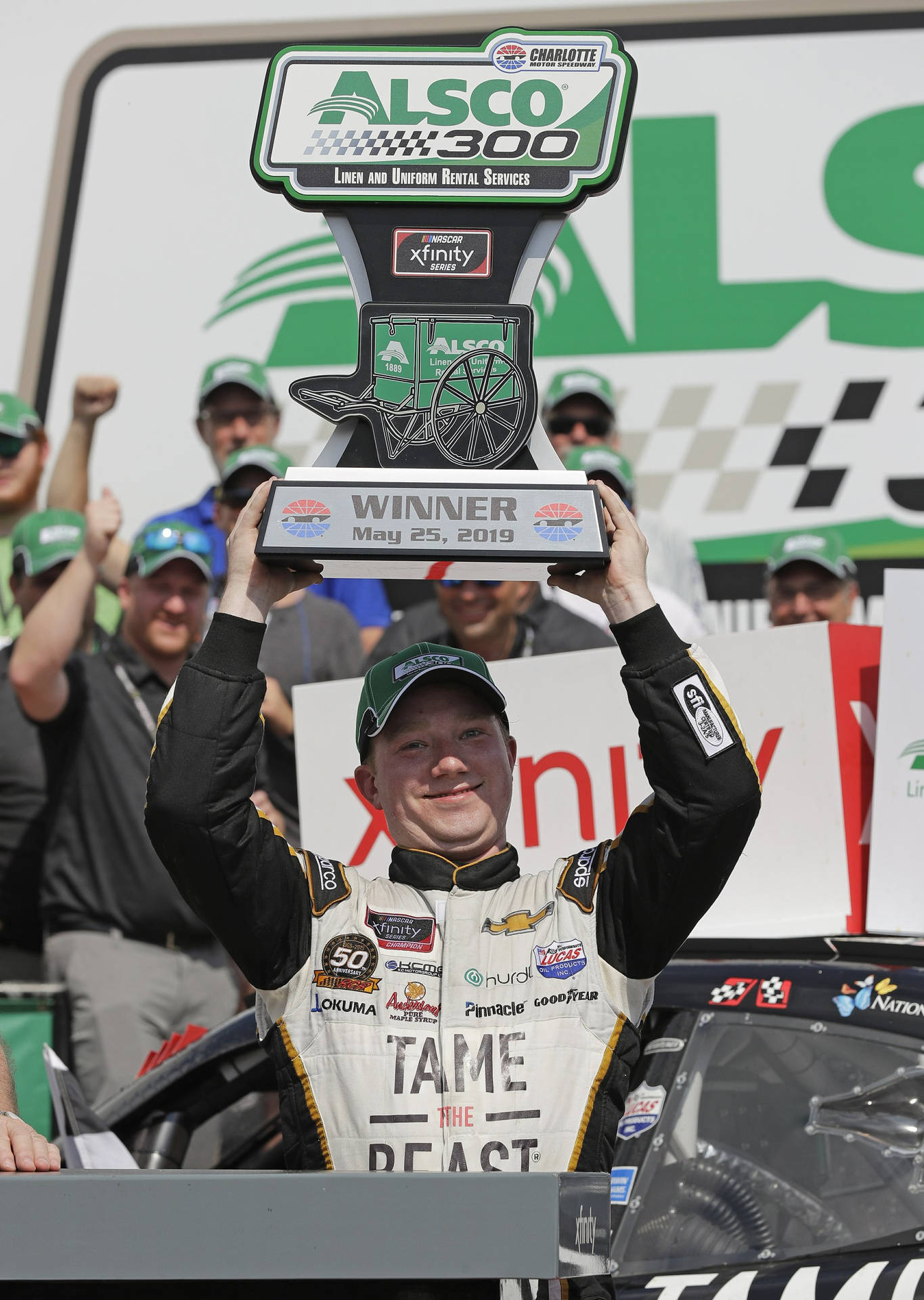 Tyler Reddick Trophy Over His Head Background