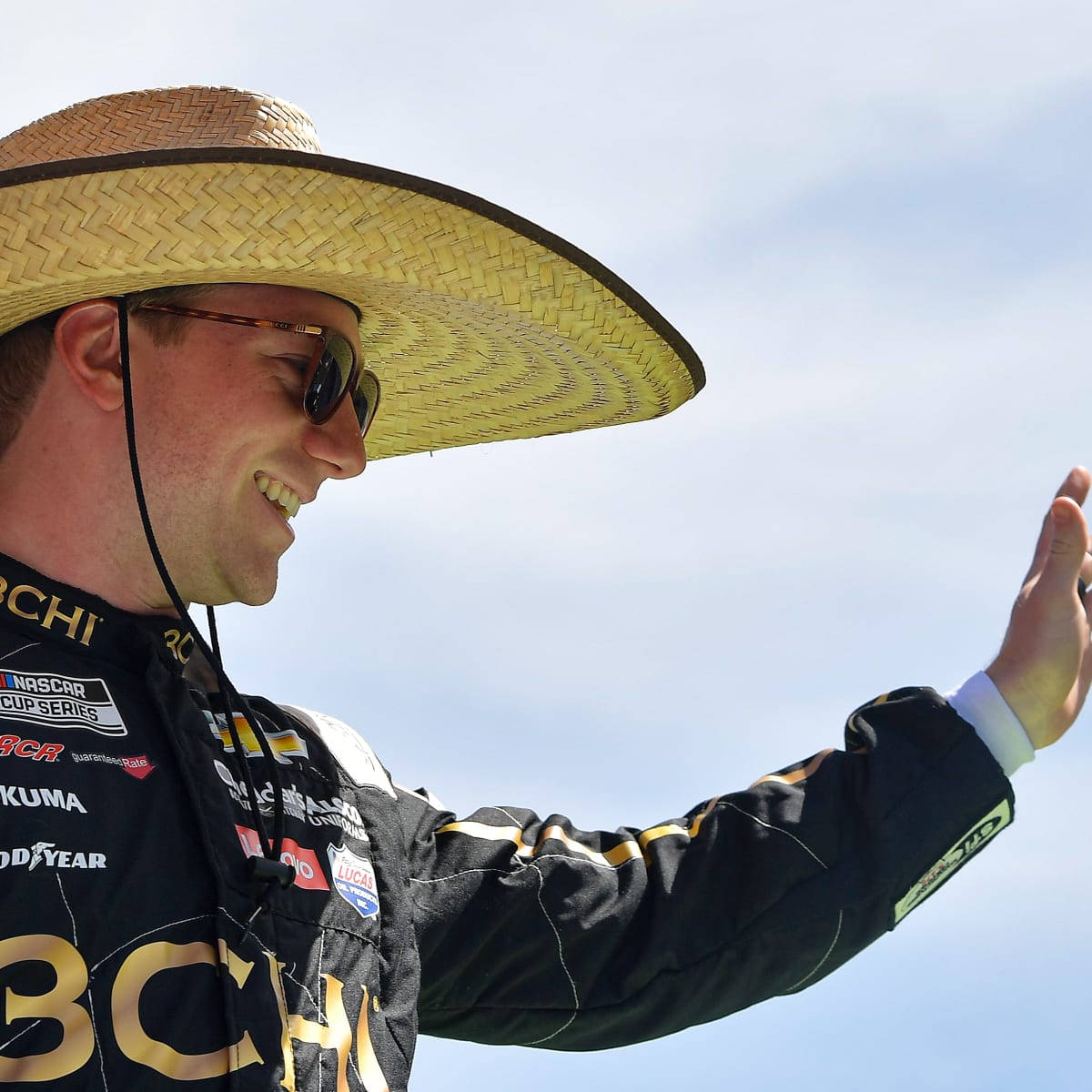 Tyler Reddick Wearing A Straw Hat Background