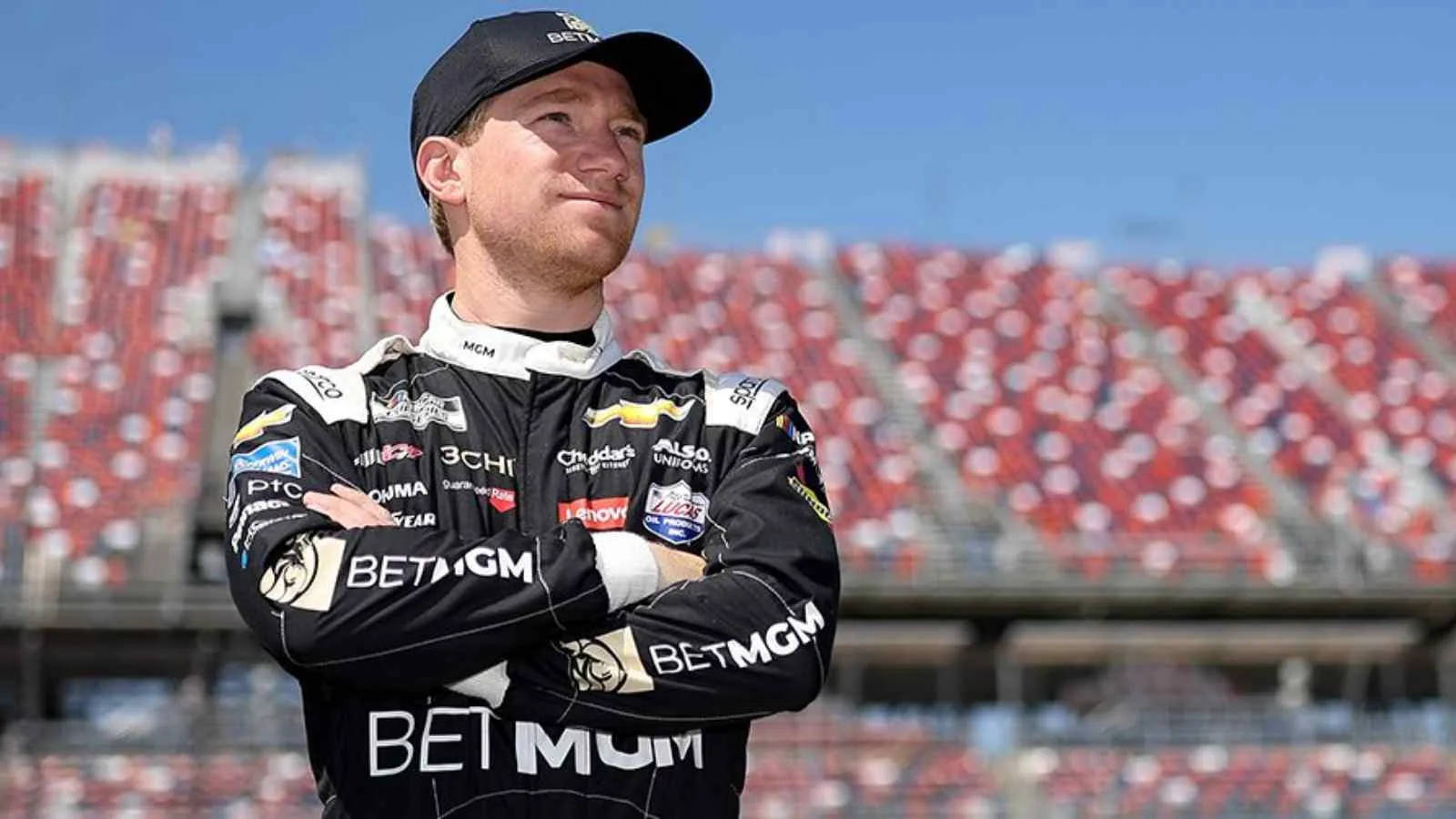 Tyler Reddick With His Arms Crossed Background